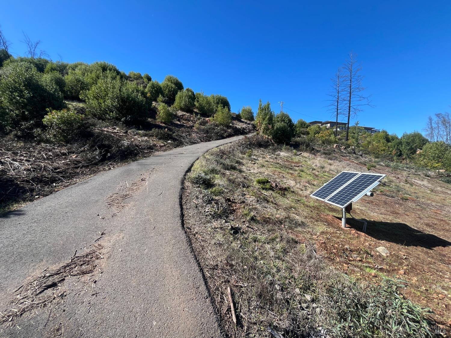 a view of a road with a yard