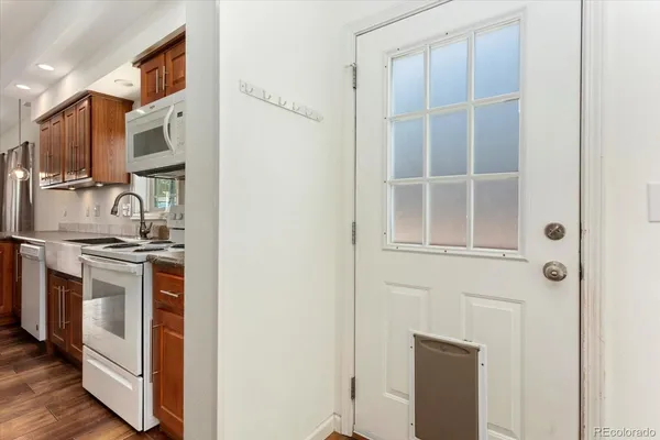 a kitchen with stainless steel appliances granite countertop a stove and a refrigerator