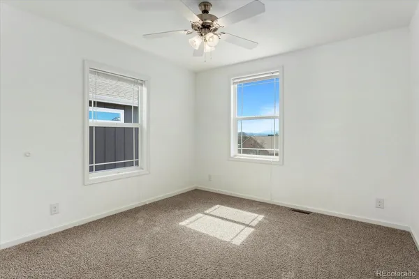 an empty room with closet area