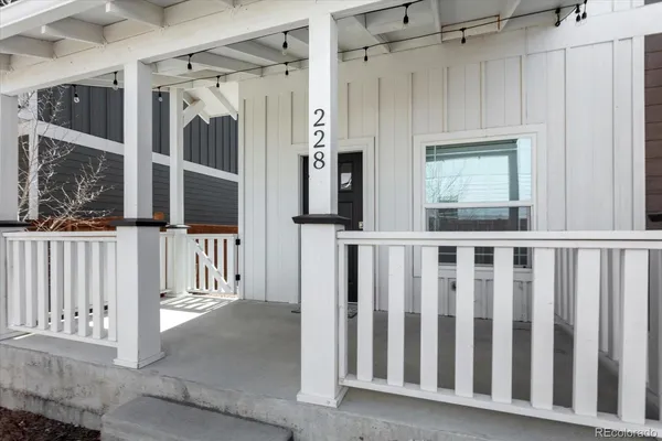 a view of a house with wooden floor and a glass door