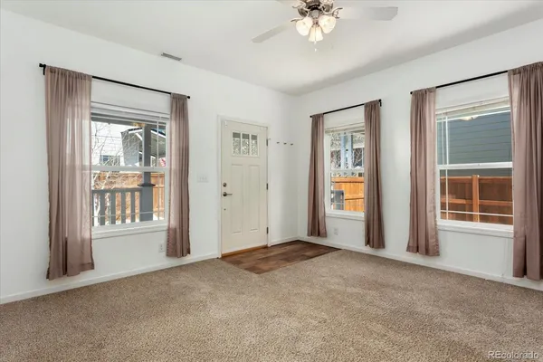 a view of an empty room with a window