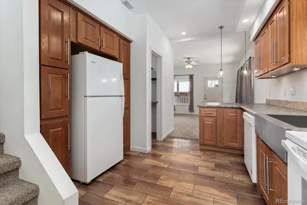 a kitchen with a refrigerator a sink and dishwasher