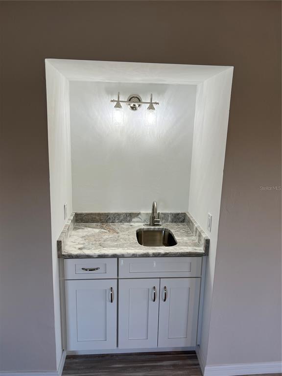 175 Kings Highway, Unit 1018 Punta Gorda, FL 33983 - Photo 11 of 35 a bathroom with a sink and a mirror