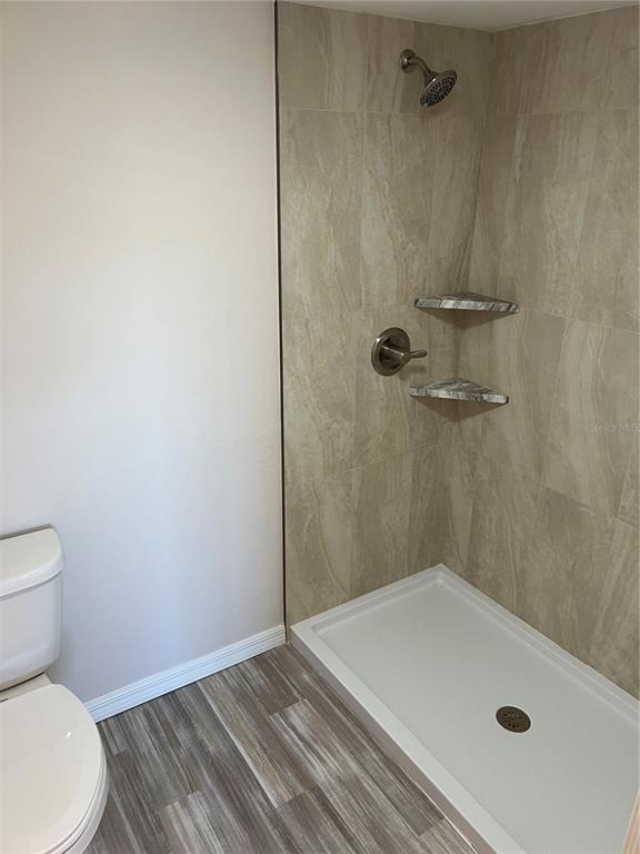 175 Kings Highway, Unit 1018 Punta Gorda, FL 33983 - Photo 16 of 35 a bathroom with a sink and a shower