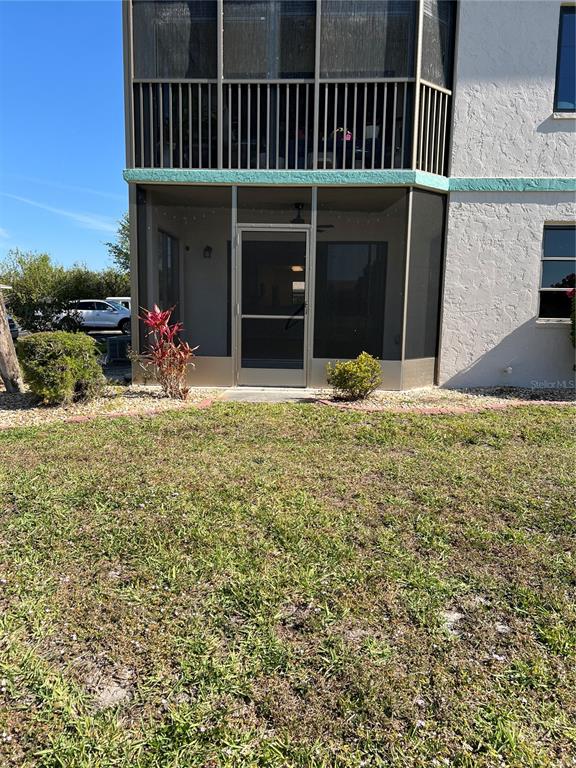 175 Kings Highway, Unit 1018 Punta Gorda, FL 33983 - Photo 20 of 35 a view of a house with backyard porch and entertaining space