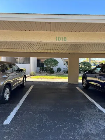 a view of a car parked in front of a building