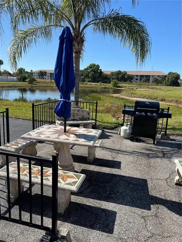 a view of a lake with houses in the back