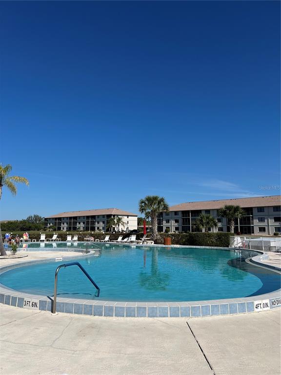 175 Kings Highway, Unit 1018 Punta Gorda, FL 33983 - Photo 30 of 35 a view of swimming pool and outdoor seating