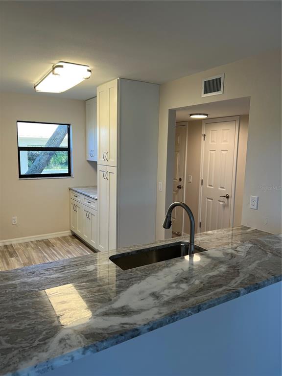 175 Kings Highway, Unit 1018 Punta Gorda, FL 33983 - Photo 8 of 35 a view of a livingroom with a hall and a stove
