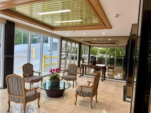 a kitchen with metallic refrigerator and sink