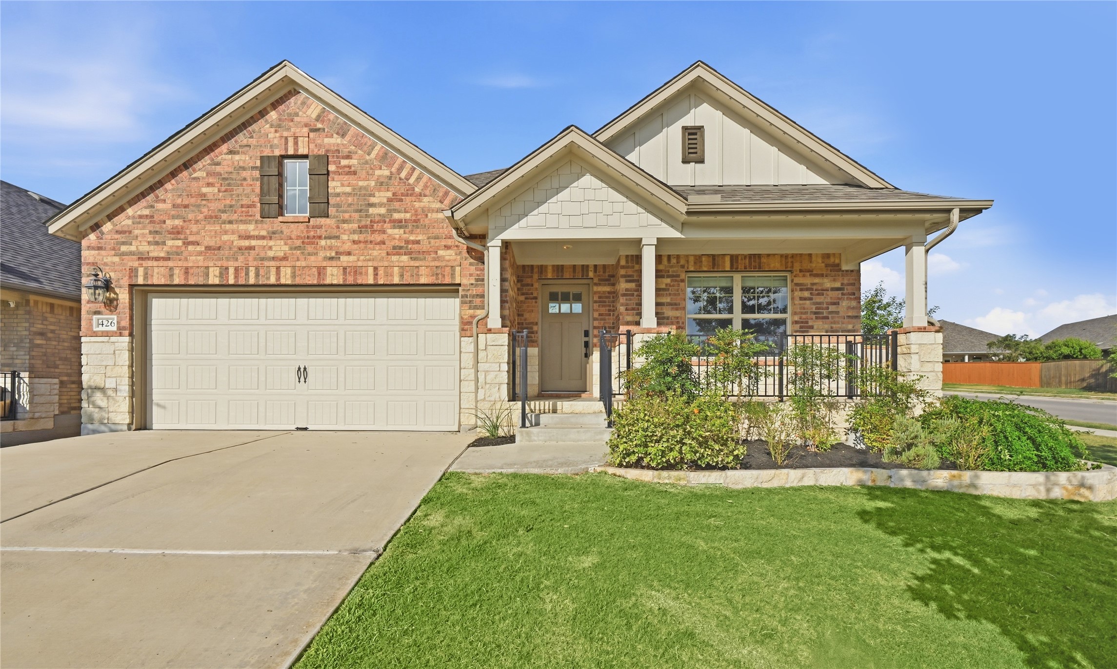 426 Cold Riv Run Kyle, TX 78640 - Photo 4 of 34 A welcoming facade with a covered entry and attached garage offers delightful curb appeal.