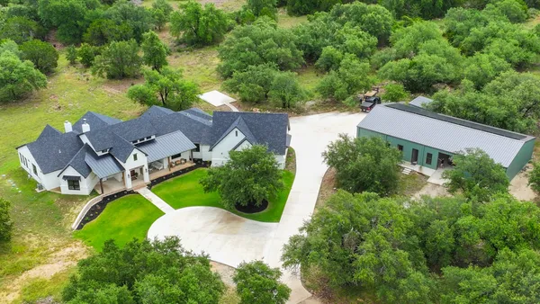an aerial view of a house with a garden