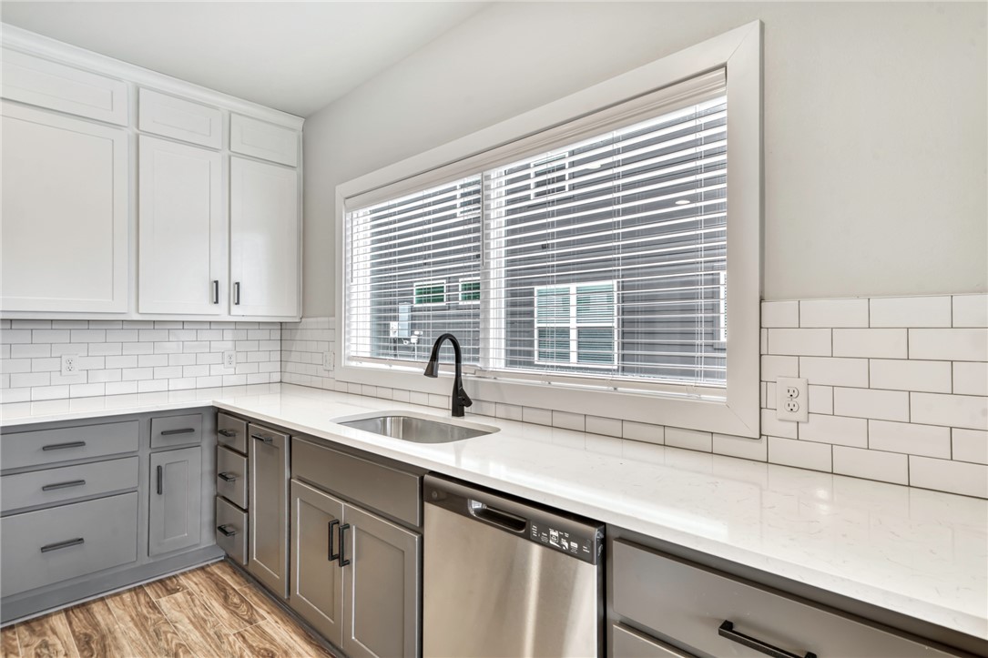 307 Cooner Street, Unit A College Station, TX 77840 - Photo 13 of 35 a kitchen with a sink and cabinets