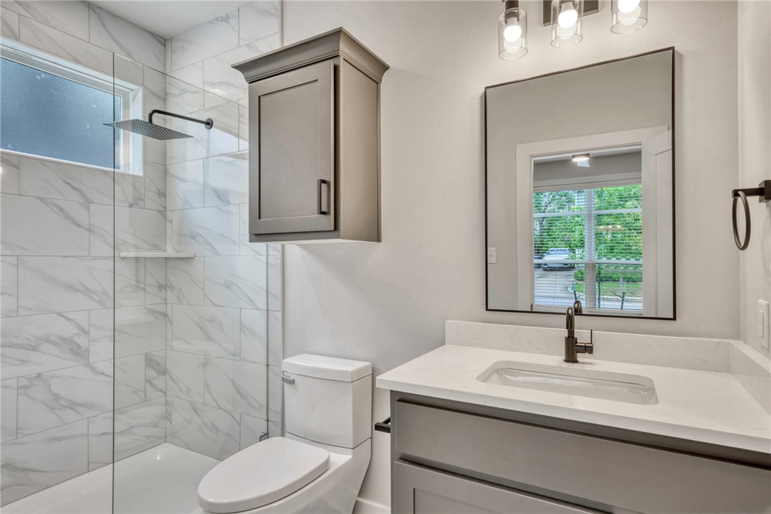 307 Cooner Street, Unit A College Station, TX 77840 - Photo 21 of 35 a bathroom with a sink toilet and shower