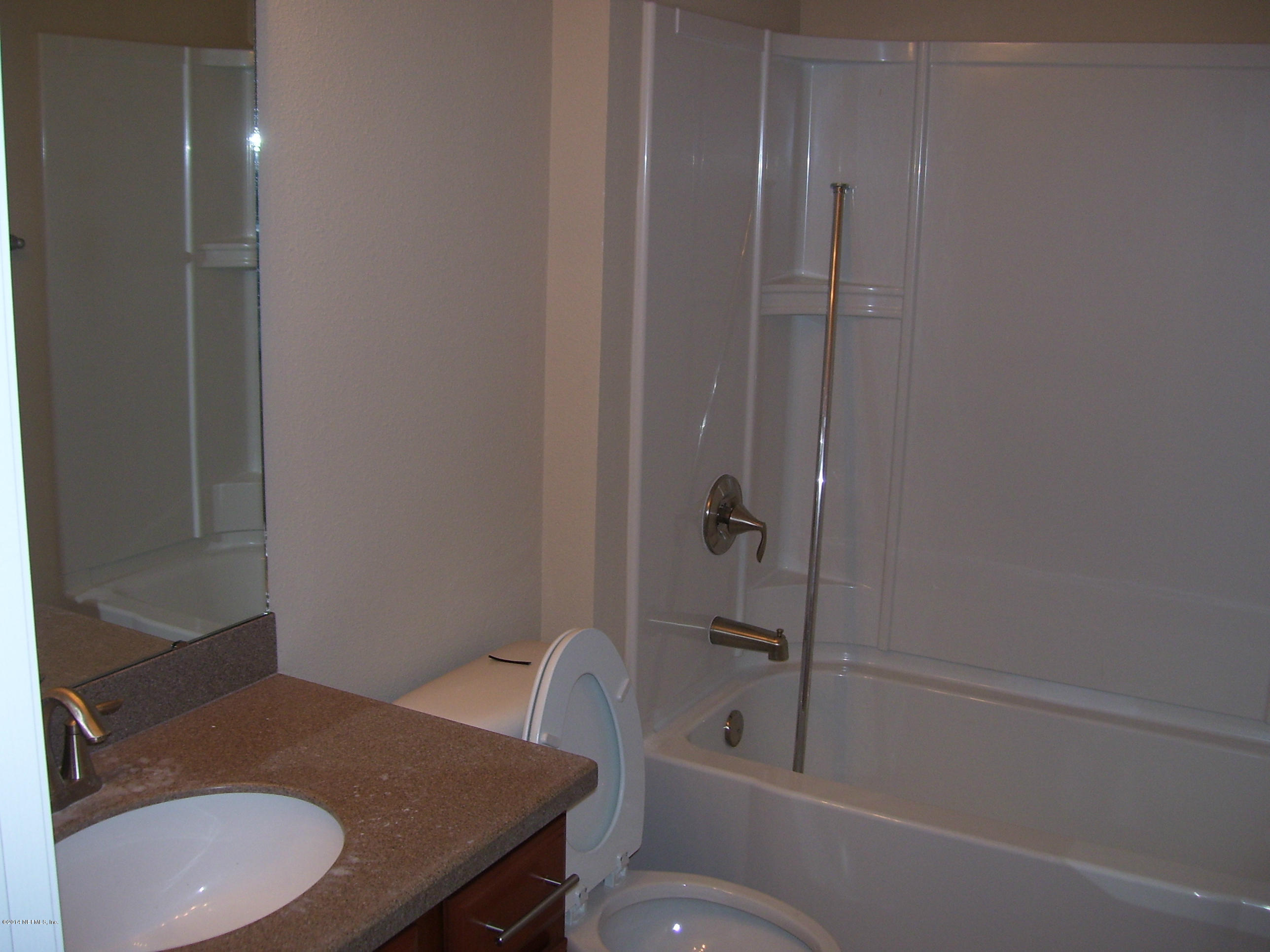 3880 Great Falls Loop Middleburg, FL 32068 - Photo 24 of 32 a bathroom with a sink and toilet