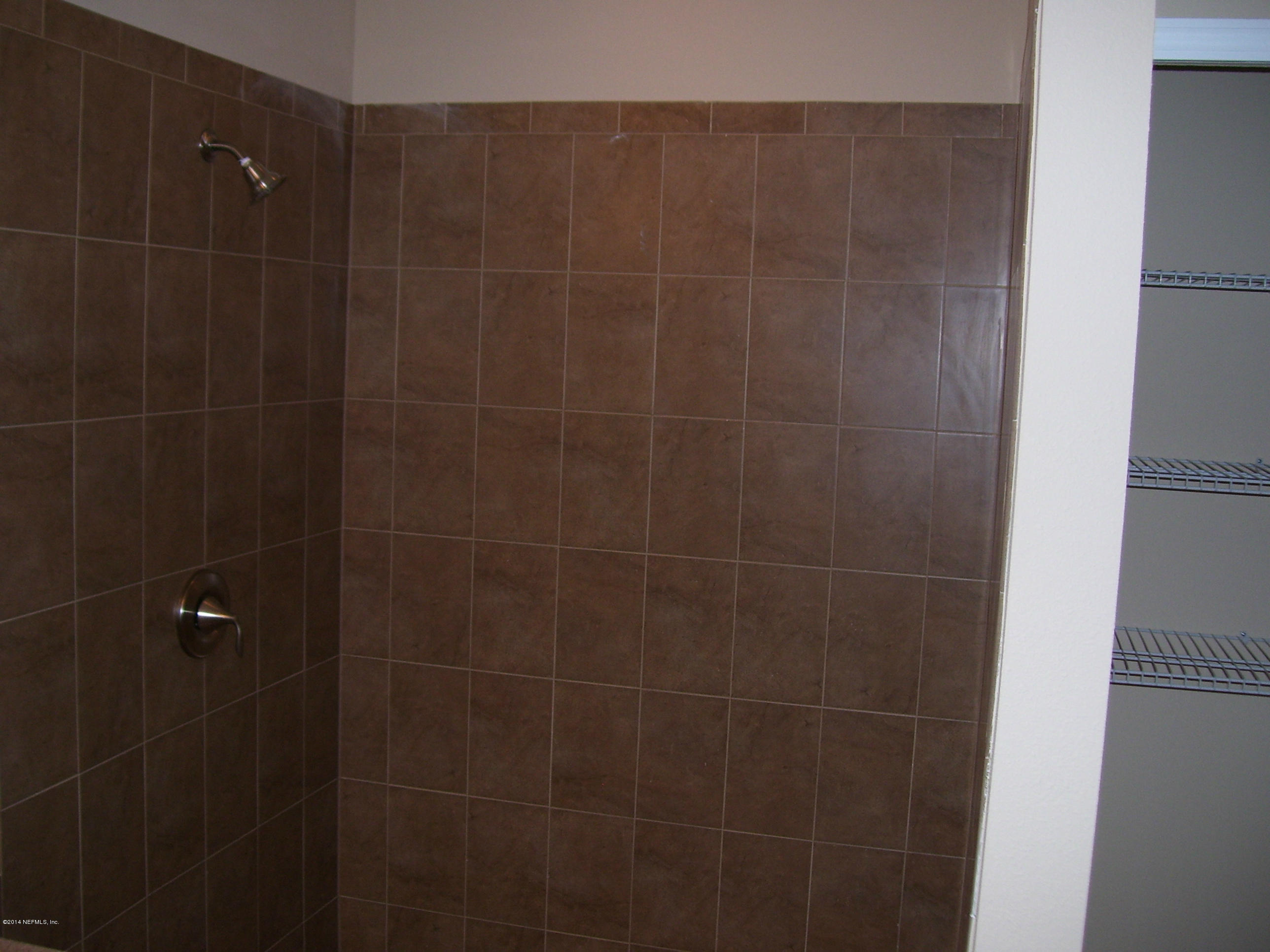 3880 Great Falls Loop Middleburg, FL 32068 - Photo 26 of 32 a bathroom with a shower