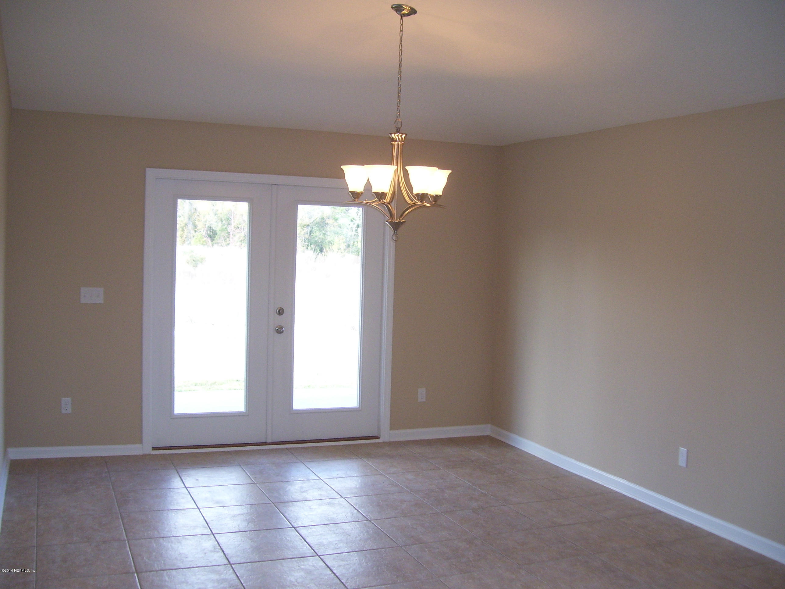 3880 Great Falls Loop Middleburg, FL 32068 - Photo 29 of 32 a view of a room with a chandelier fan and window