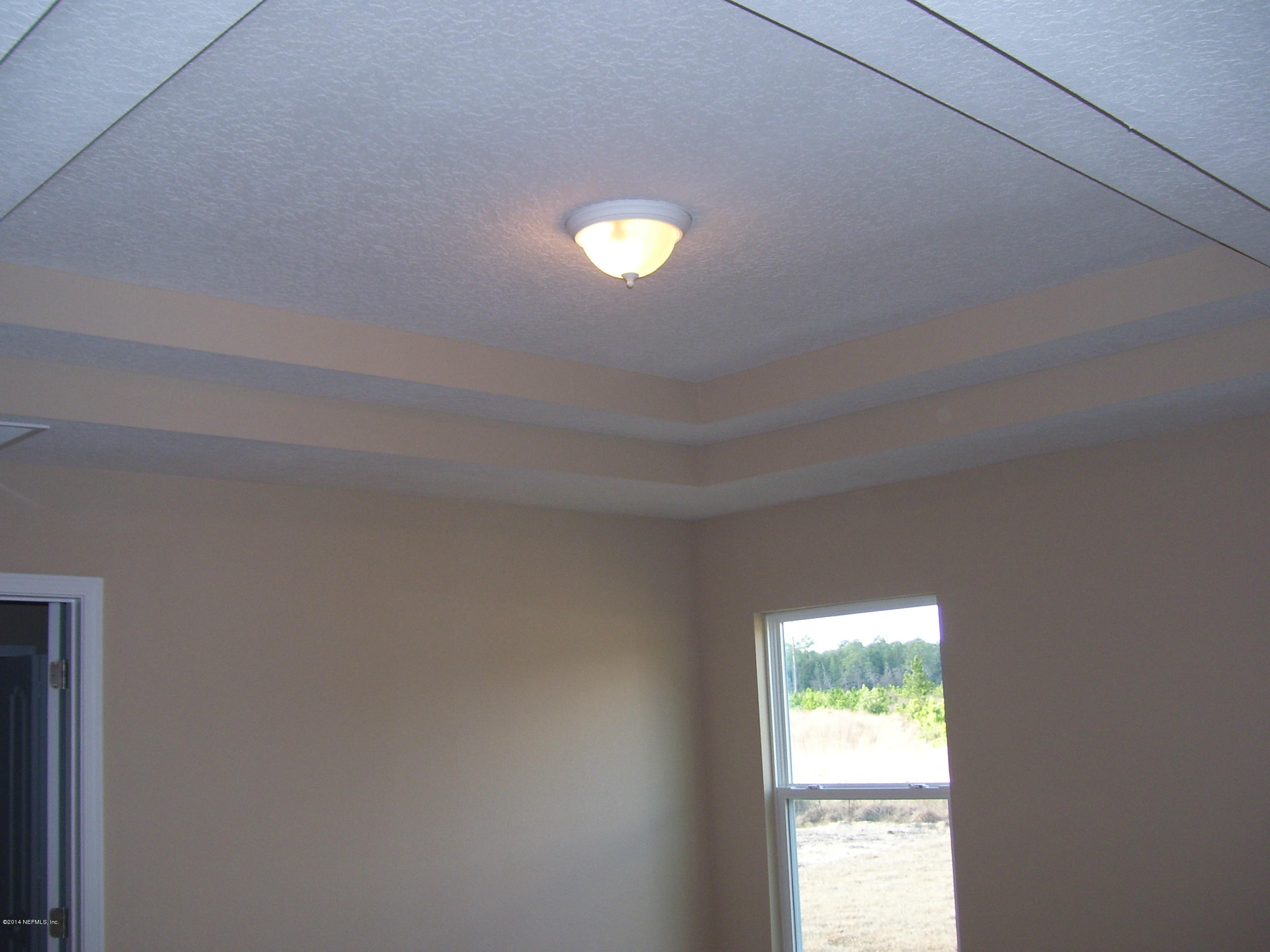 3880 Great Falls Loop Middleburg, FL 32068 - Photo 31 of 32 a view of an empty room with a window