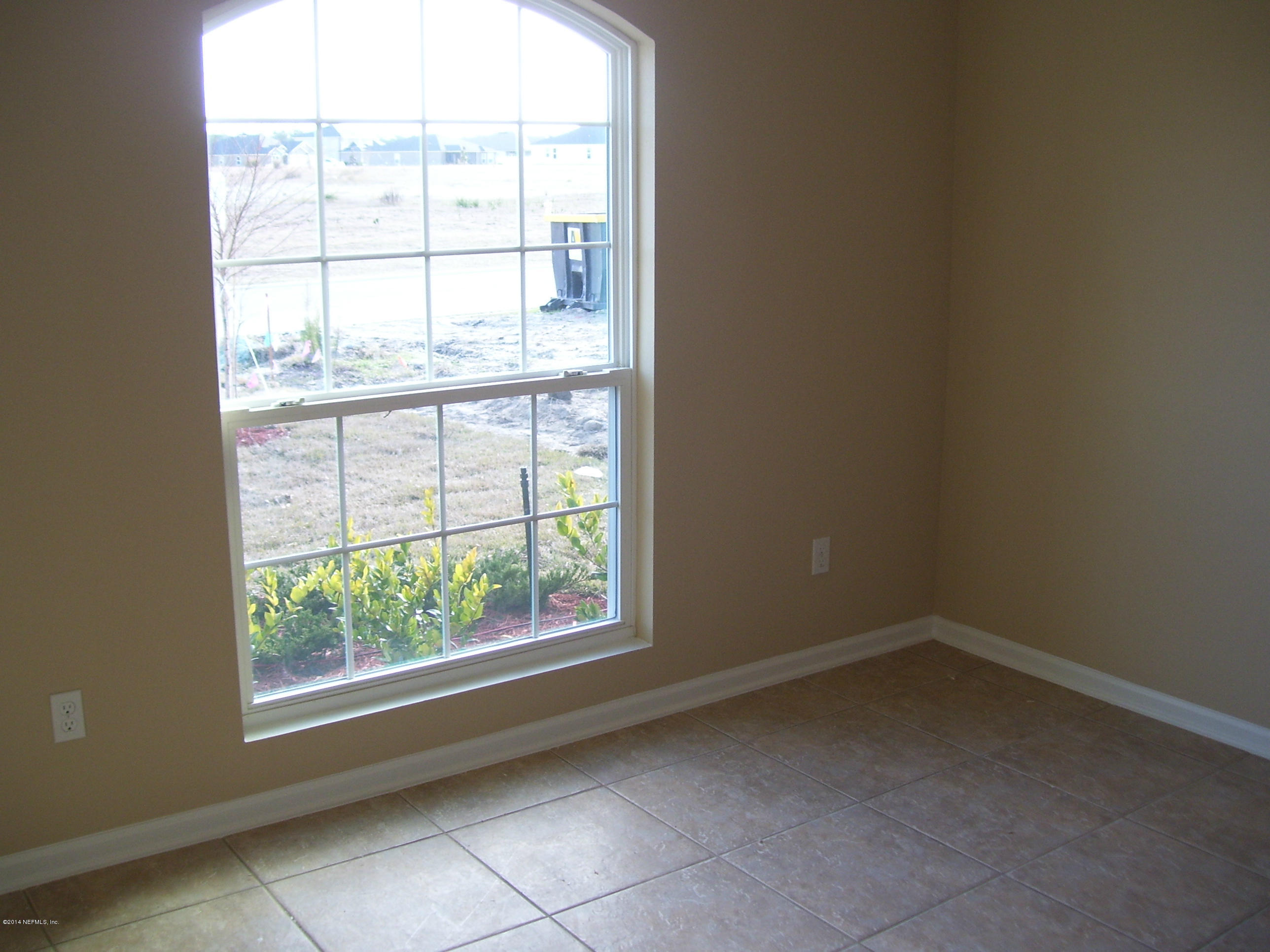 3880 Great Falls Loop Middleburg, FL 32068 - Photo 32 of 32 an empty room with a window