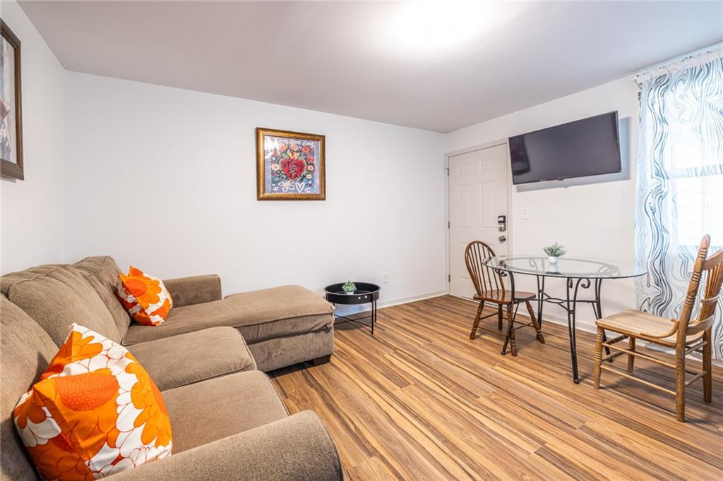 4350 Welcome All, Unit 1 Atlanta, GA 30349 - Photo 11 of 22 a living room with furniture and a flat screen tv
