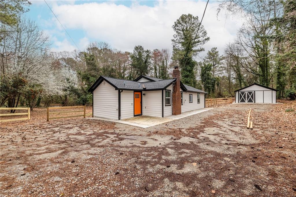 4350 Welcome All, Unit 1 Atlanta, GA 30349 - Photo 22 of 22 a house with trees in the background