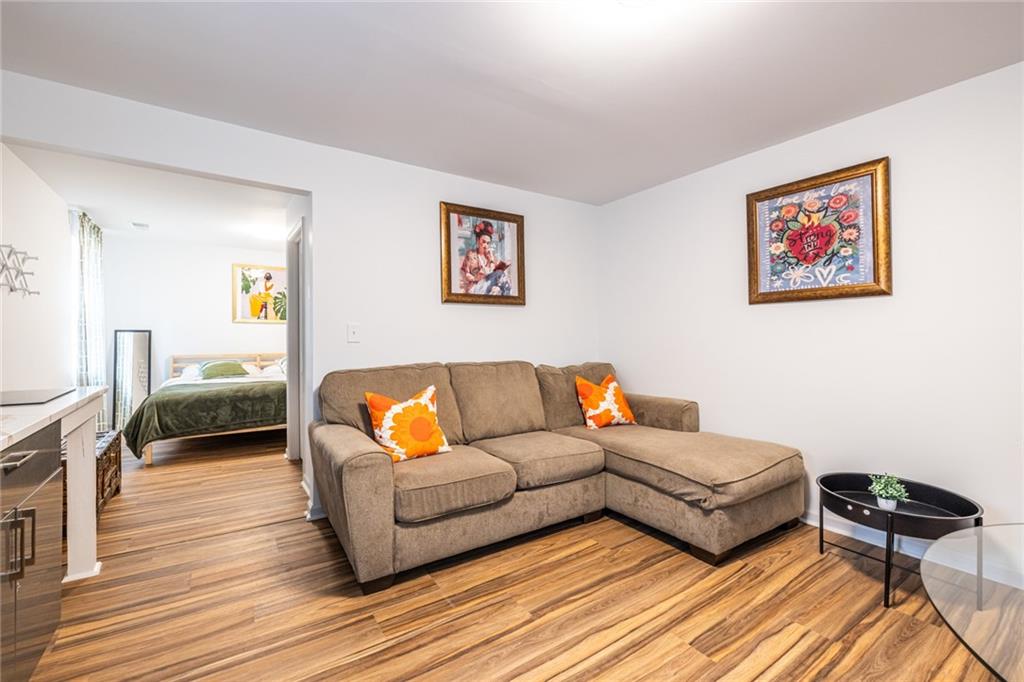 4350 Welcome All, Unit 1 Atlanta, GA 30349 - Photo 7 of 22 a living room with furniture and a wooden floor