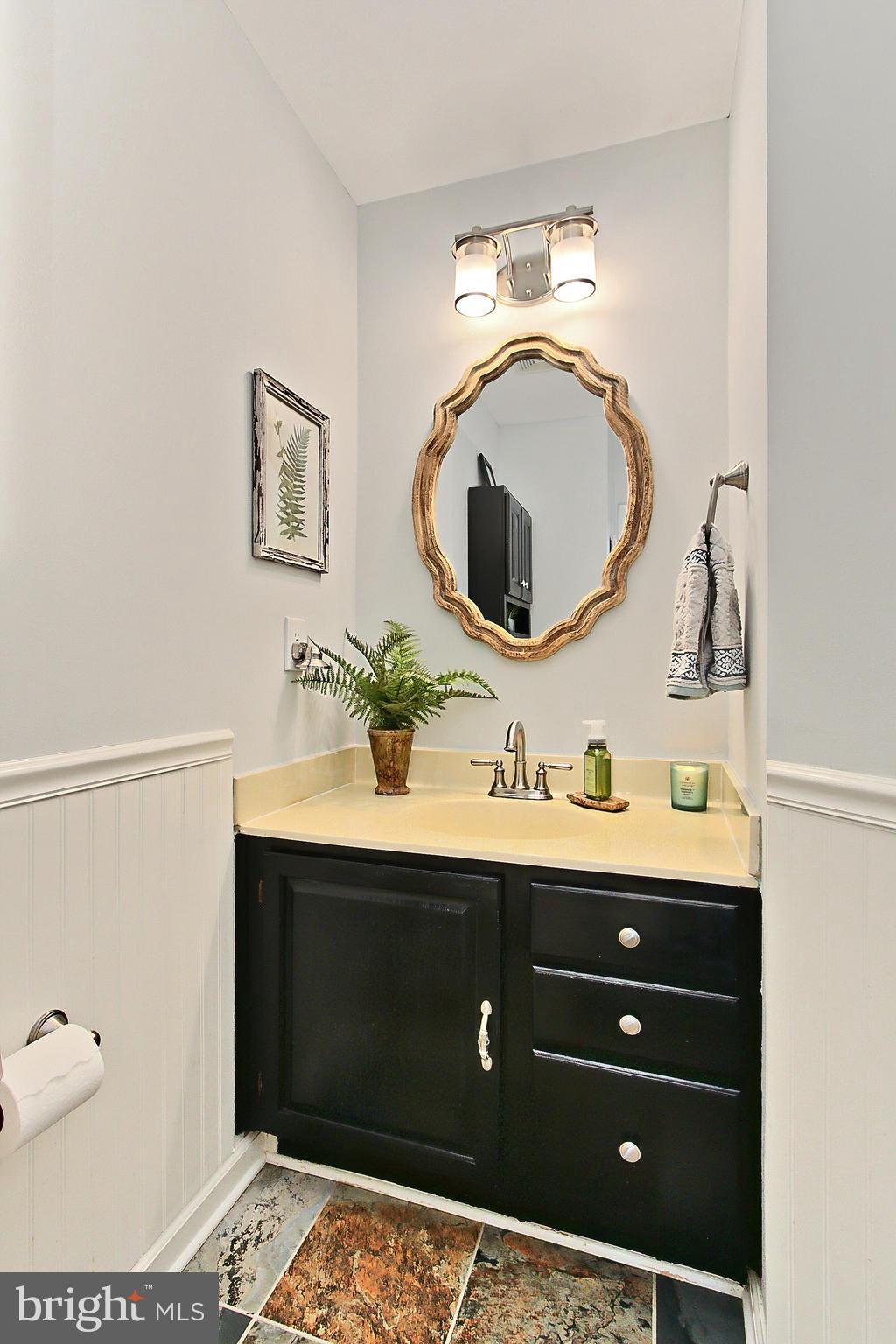 6306 Lee Forest Path Centreville, VA 20120 - Photo 18 of 49 a bathroom with a sink and a mirror