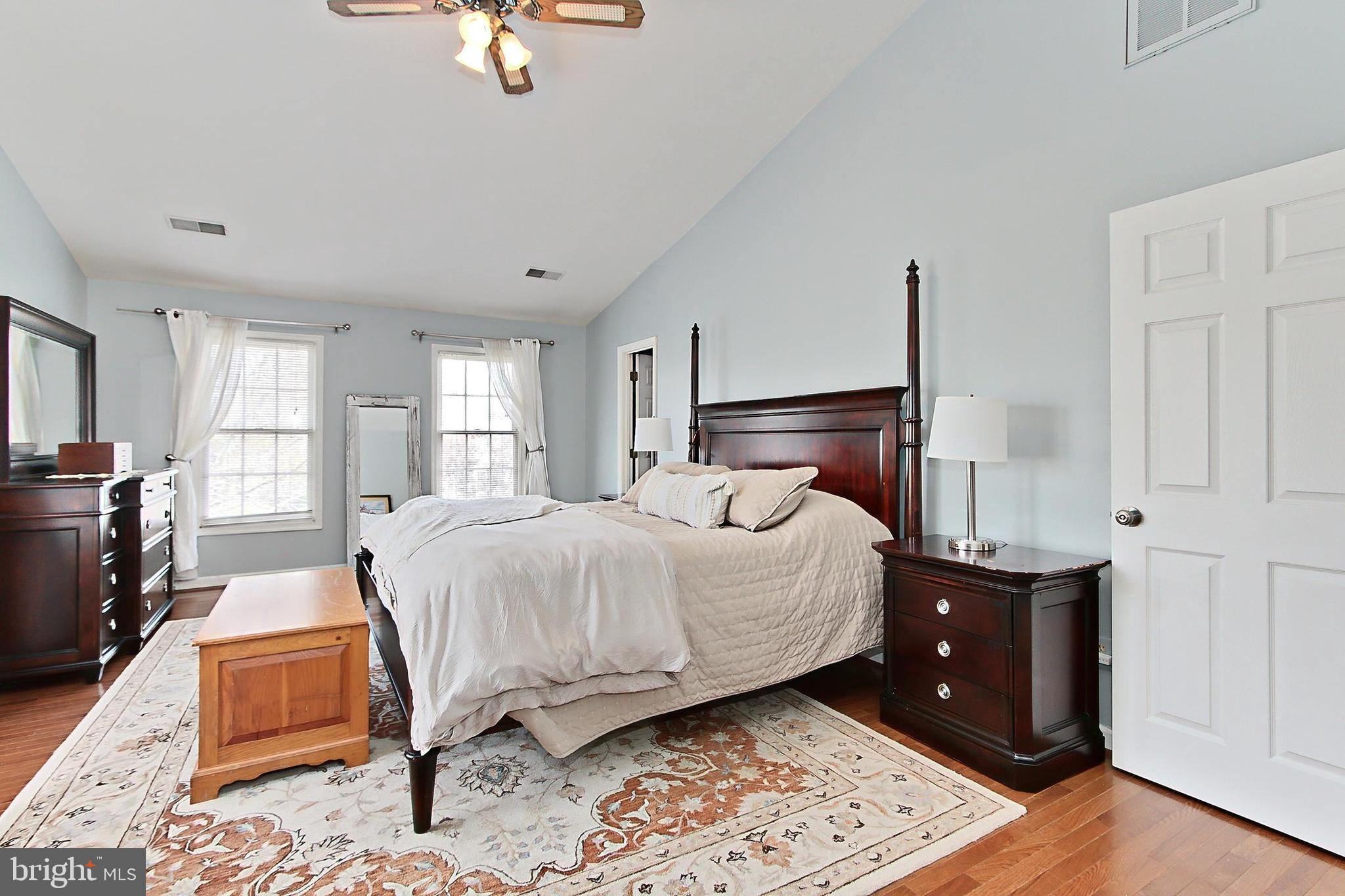 6306 Lee Forest Path Centreville, VA 20120 - Photo 21 of 49 a bedroom with a bed and wooden floor