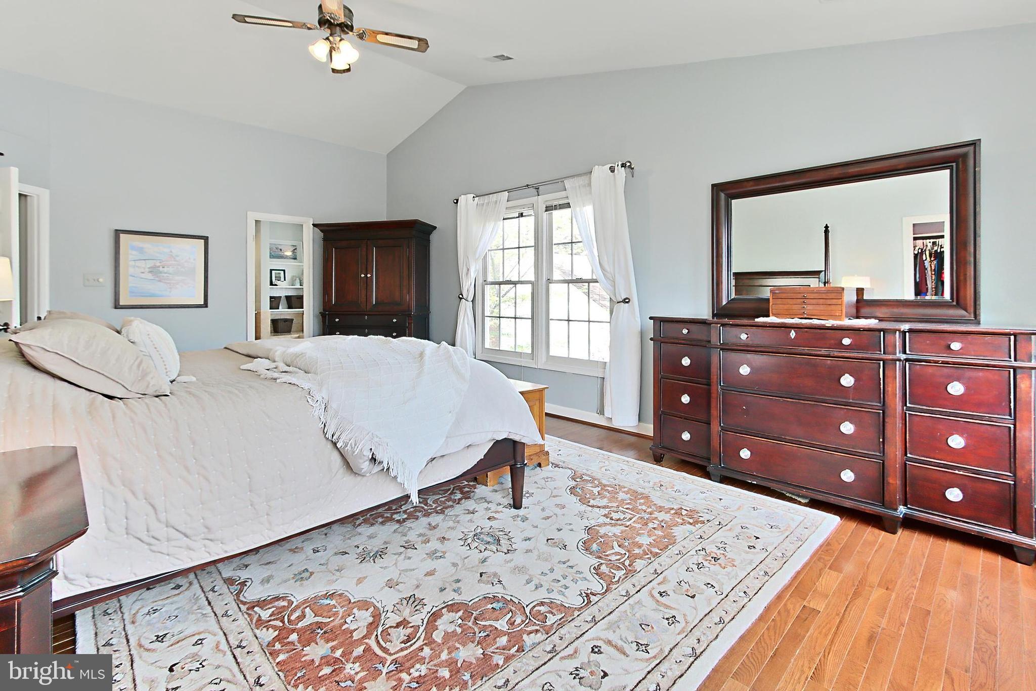 6306 Lee Forest Path Centreville, VA 20120 - Photo 22 of 49 a living room with a bed and a dresser