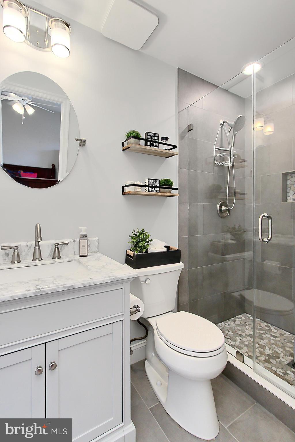 6306 Lee Forest Path Centreville, VA 20120 - Photo 27 of 49 a bathroom with a sink a toilet and shower