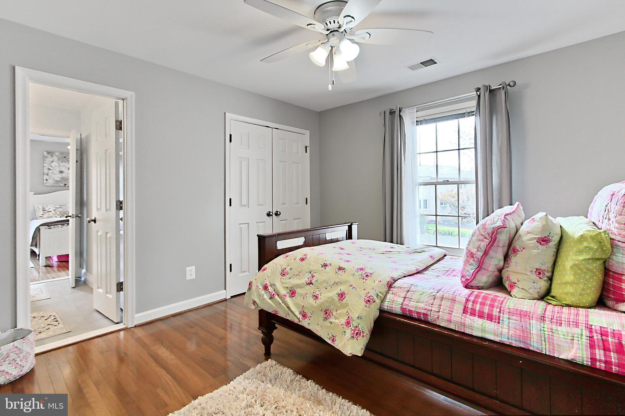 6306 Lee Forest Path Centreville, VA 20120 - Photo 29 of 49 a bedroom with a bed and a chandelier