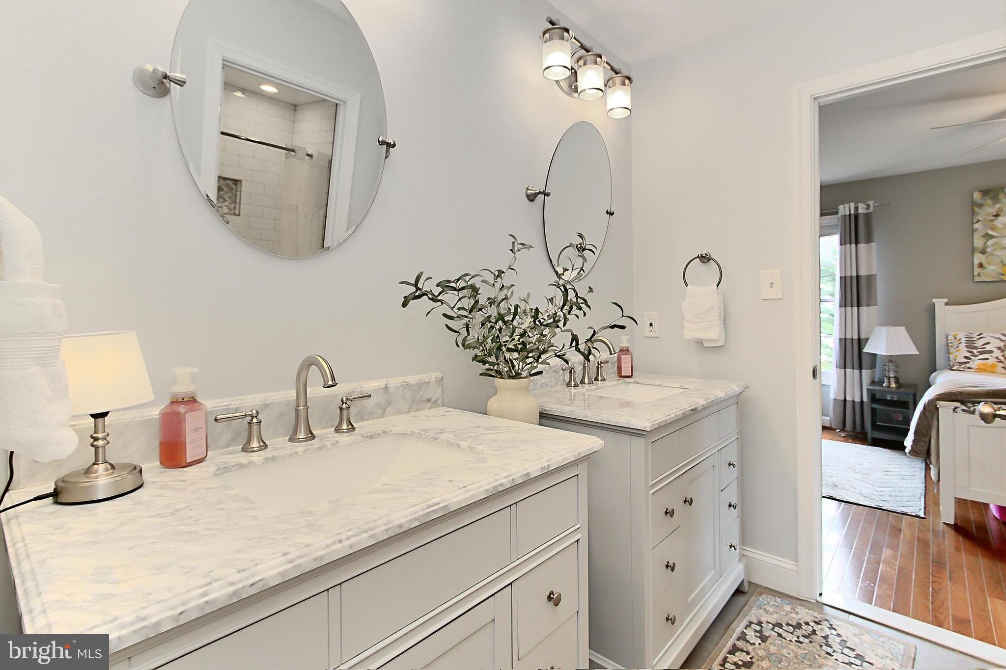 6306 Lee Forest Path Centreville, VA 20120 - Photo 30 of 49 a bathroom with double vanity sink and a mirror