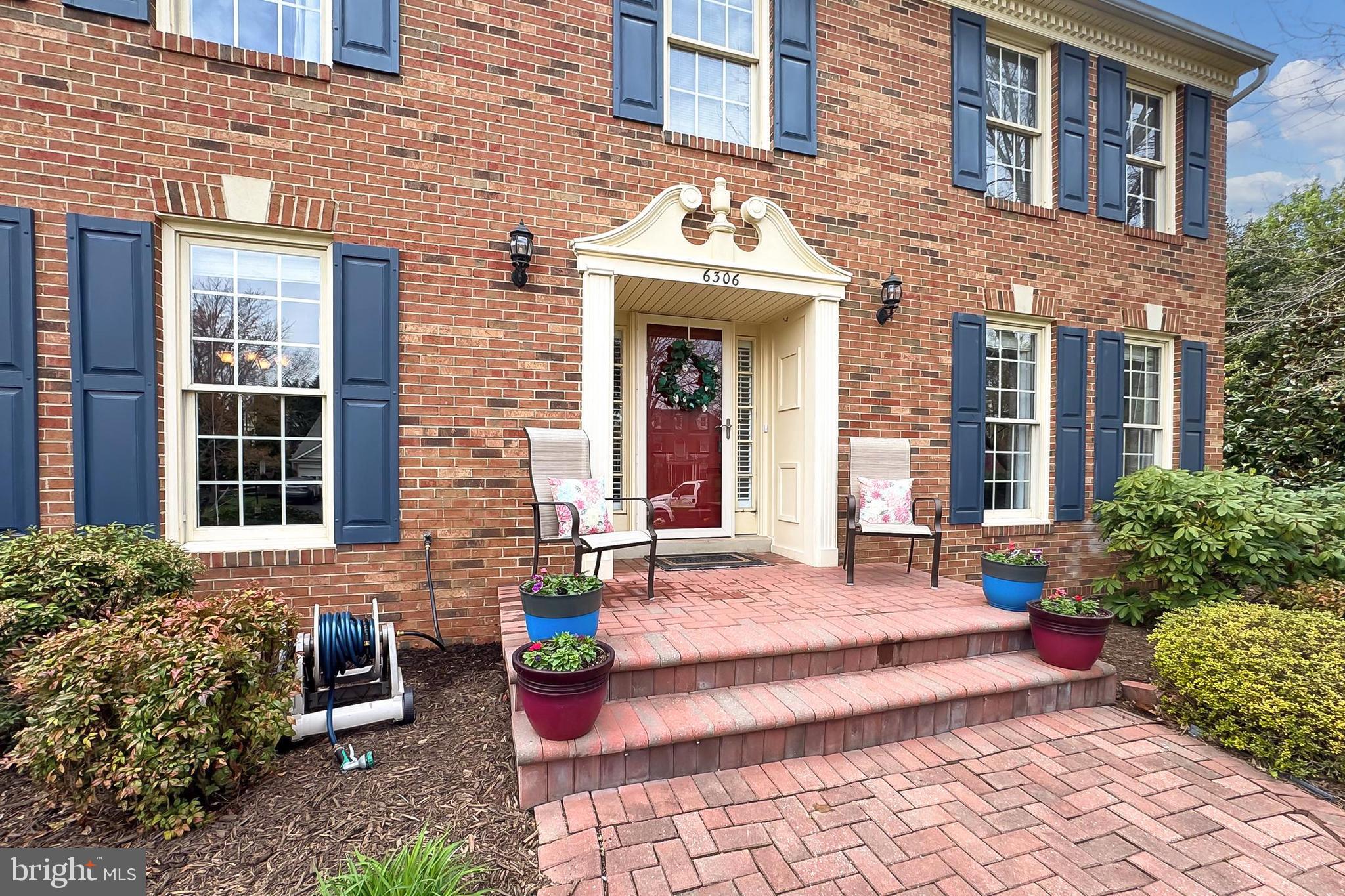 6306 Lee Forest Path Centreville, VA 20120 - Photo 3 of 49 a view of a brick building with many windows