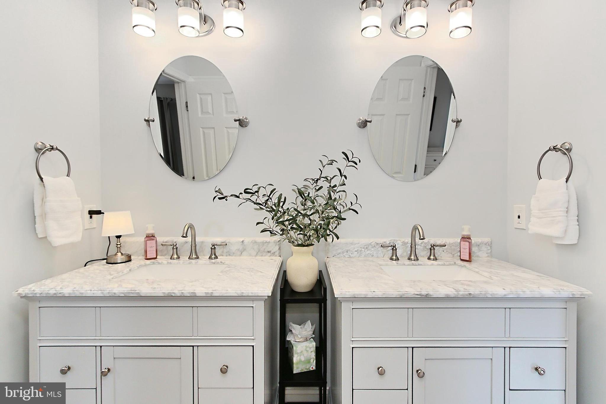 6306 Lee Forest Path Centreville, VA 20120 - Photo 31 of 49 a bathroom with double vanity sinks and a mirror