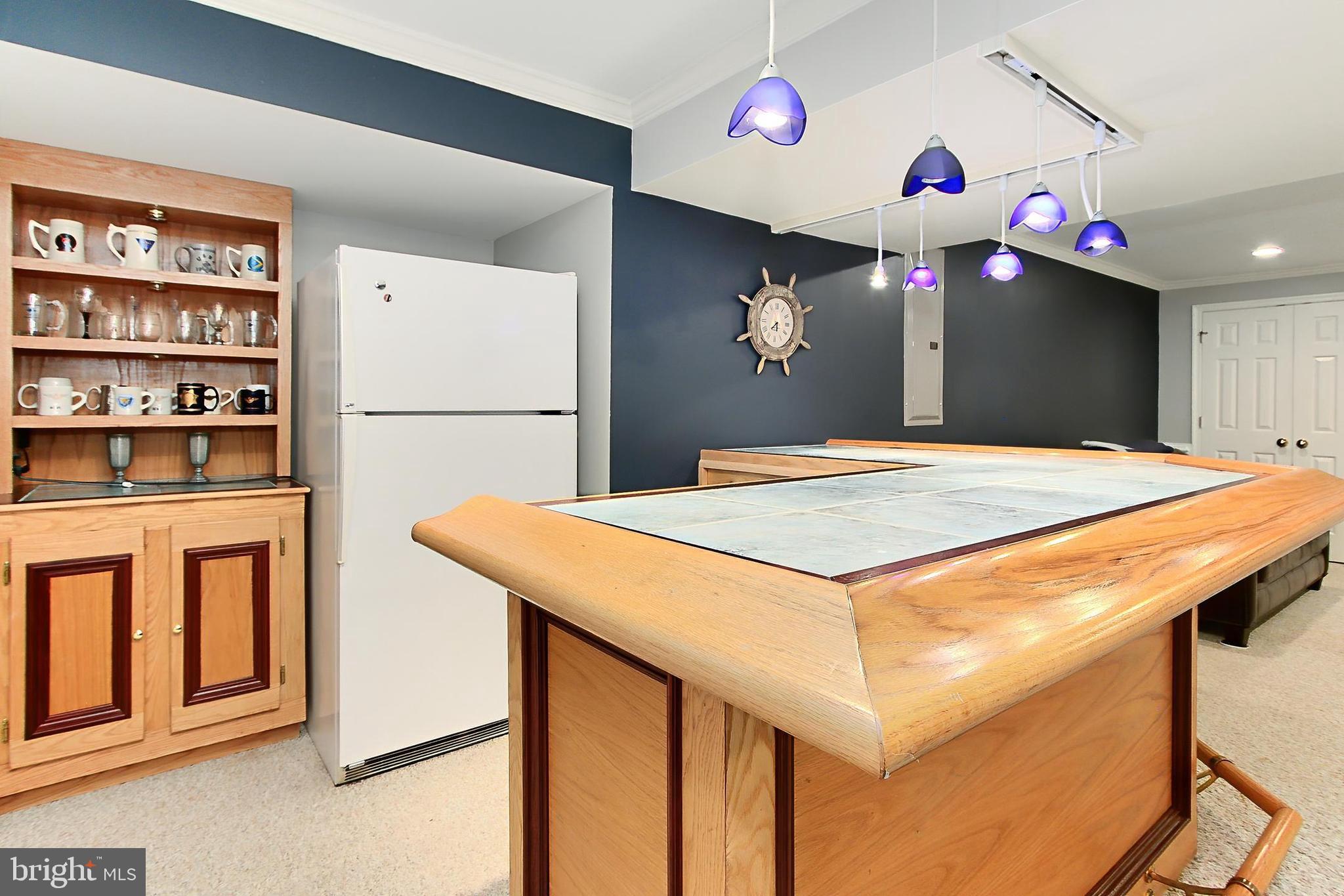 6306 Lee Forest Path Centreville, VA 20120 - Photo 35 of 49 a kitchen that has a table and a refrigerator