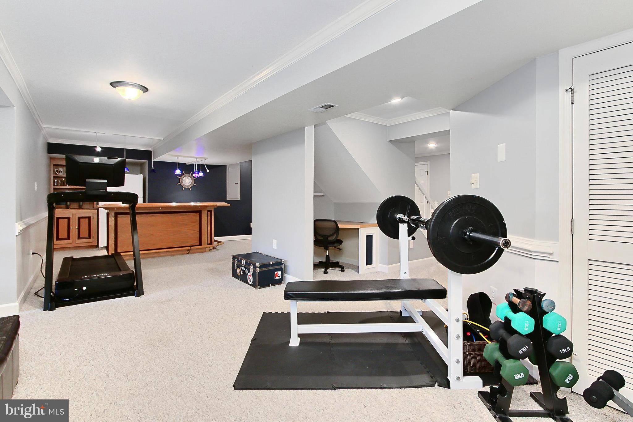 6306 Lee Forest Path Centreville, VA 20120 - Photo 36 of 49 a room with furniture and a wooden floor