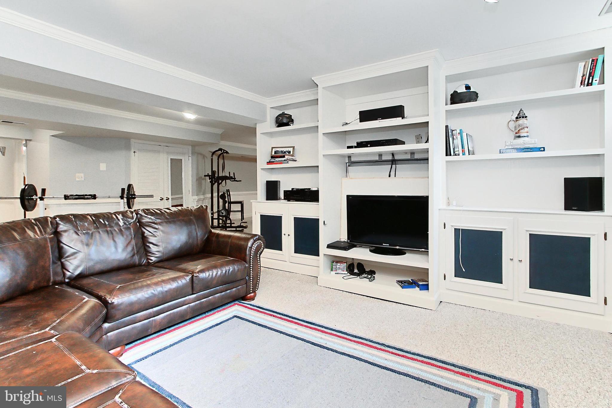 6306 Lee Forest Path Centreville, VA 20120 - Photo 37 of 49 a living room with furniture and a flat screen tv