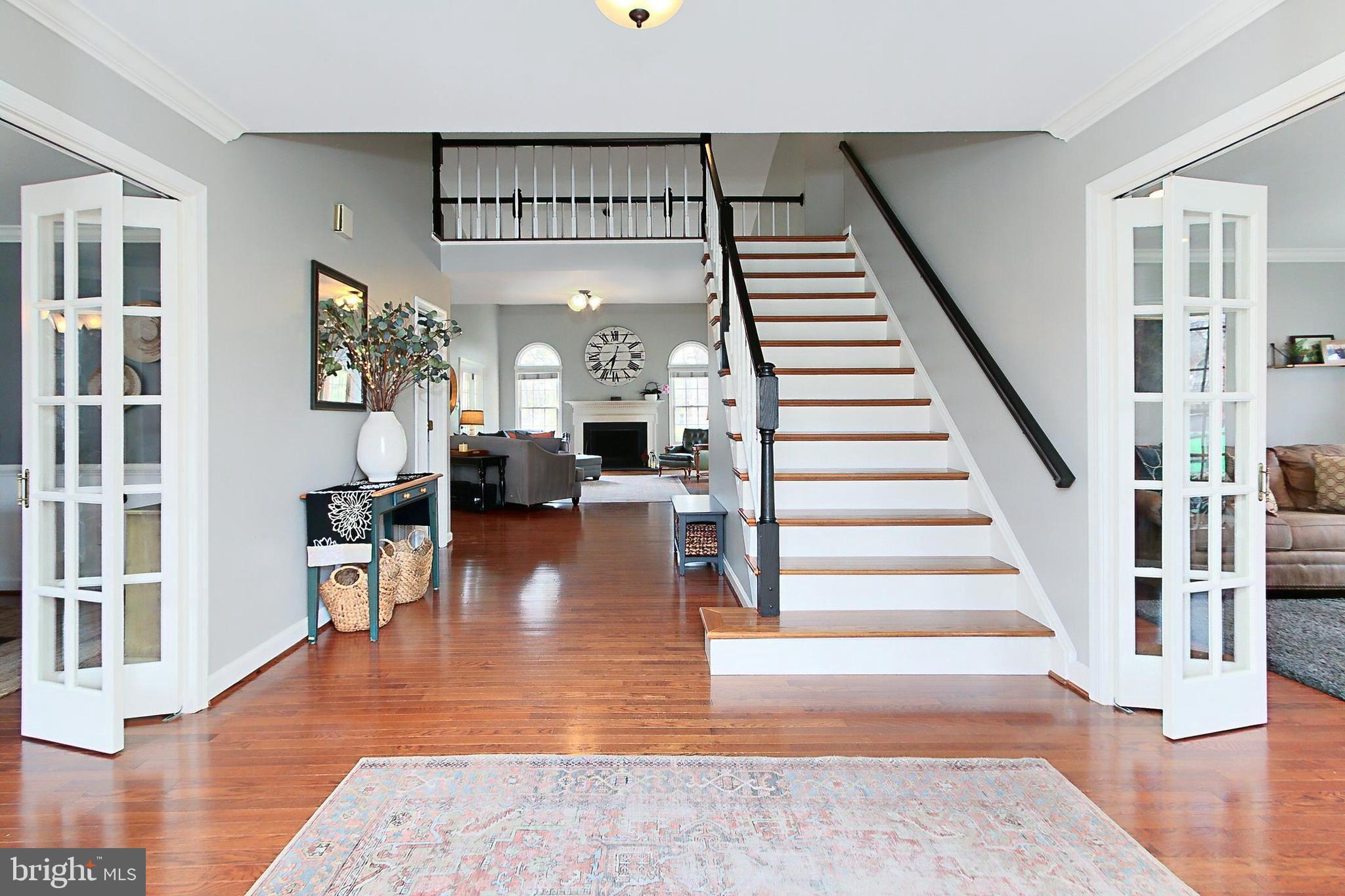 6306 Lee Forest Path Centreville, VA 20120 - Photo 4 of 49 a view of entryway and hall with wooden floor