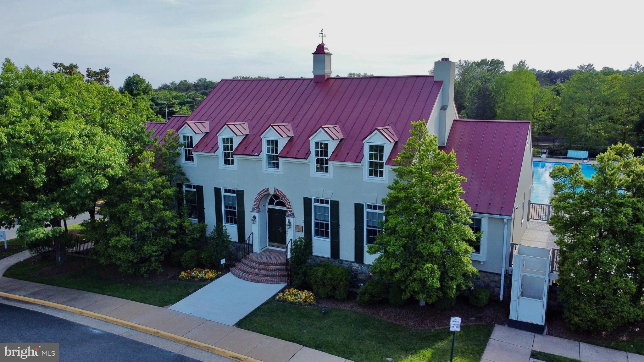 6306 Lee Forest Path Centreville, VA 20120 - Photo 47 of 49 a front view of a house with garden
