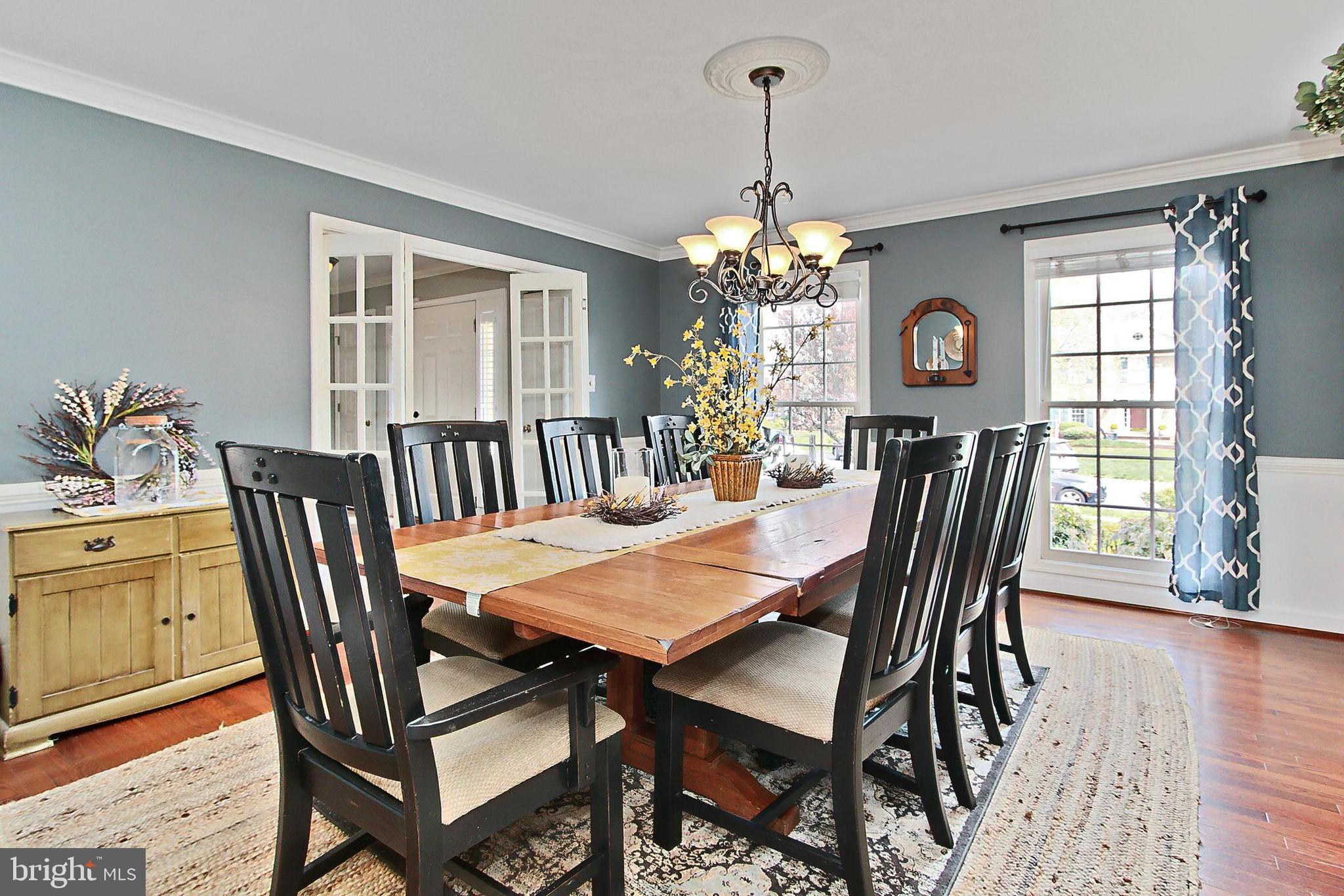 6306 Lee Forest Path Centreville, VA 20120 - Photo 7 of 49 a view of a dining room with furniture window and wooden floor