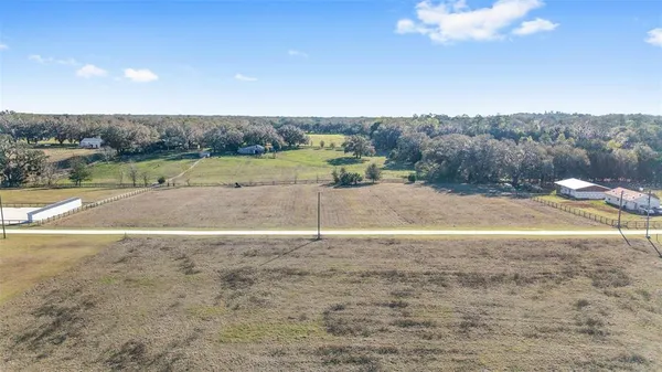 an aerial view of a golf course with a big yard
