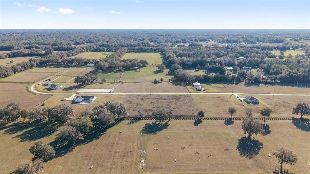 56 Northwest Court Road Reddick, FL 32686 - Photo 22 of 25 an aerial view of residential houses with outdoor space