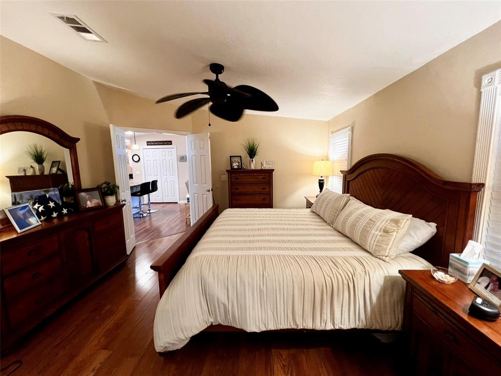5601 Duncan Road, Unit 96 Punta Gorda, FL 33982 - Photo 11 of 30 a bedroom with bed and wooden floor