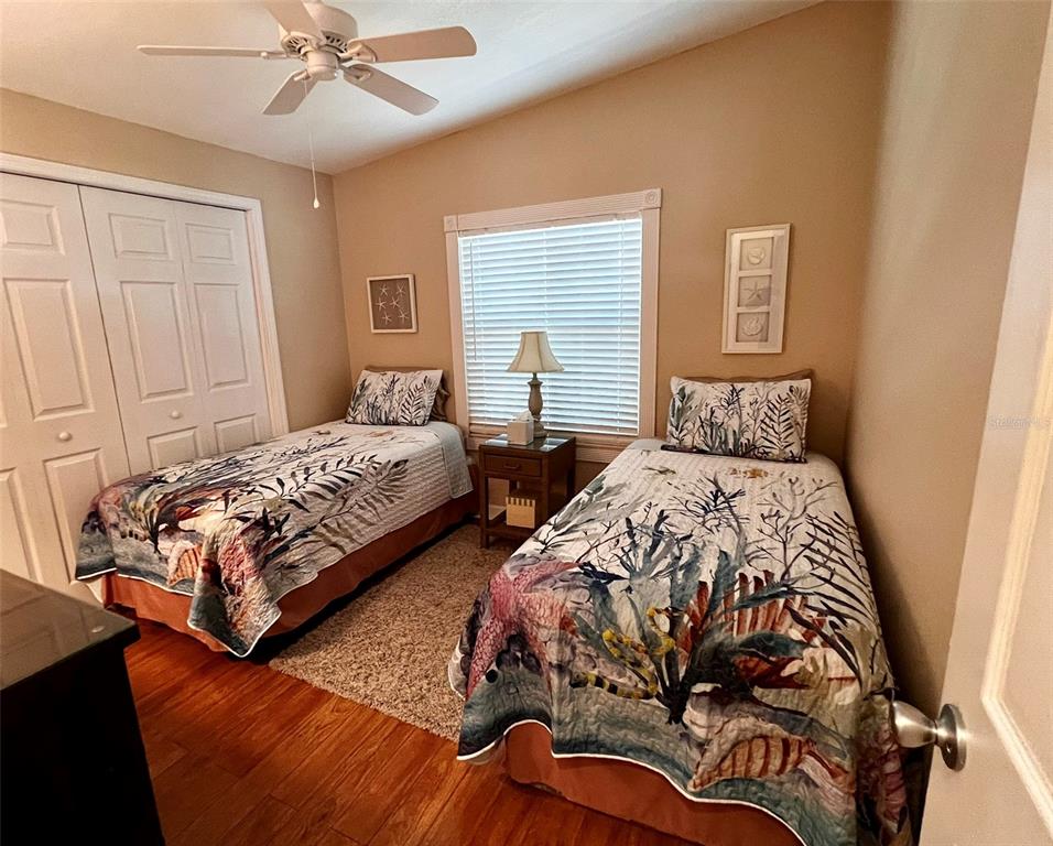 5601 Duncan Road, Unit 96 Punta Gorda, FL 33982 - Photo 18 of 30 a bedroom with two beds and painting on the wall