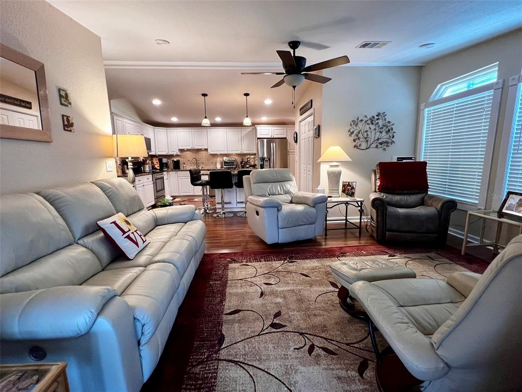 5601 Duncan Road, Unit 96 Punta Gorda, FL 33982 - Photo 19 of 30 a living room with furniture ceiling fan and a window