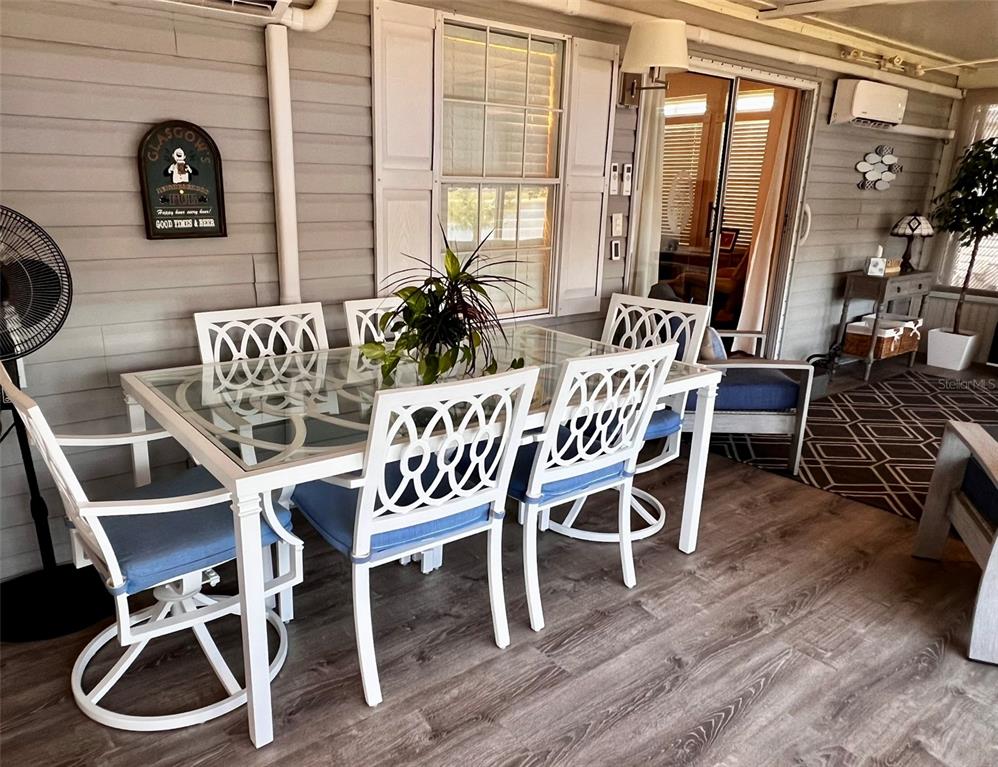 5601 Duncan Road, Unit 96 Punta Gorda, FL 33982 - Photo 22 of 30 a view of a dining room with furniture window and wooden floor