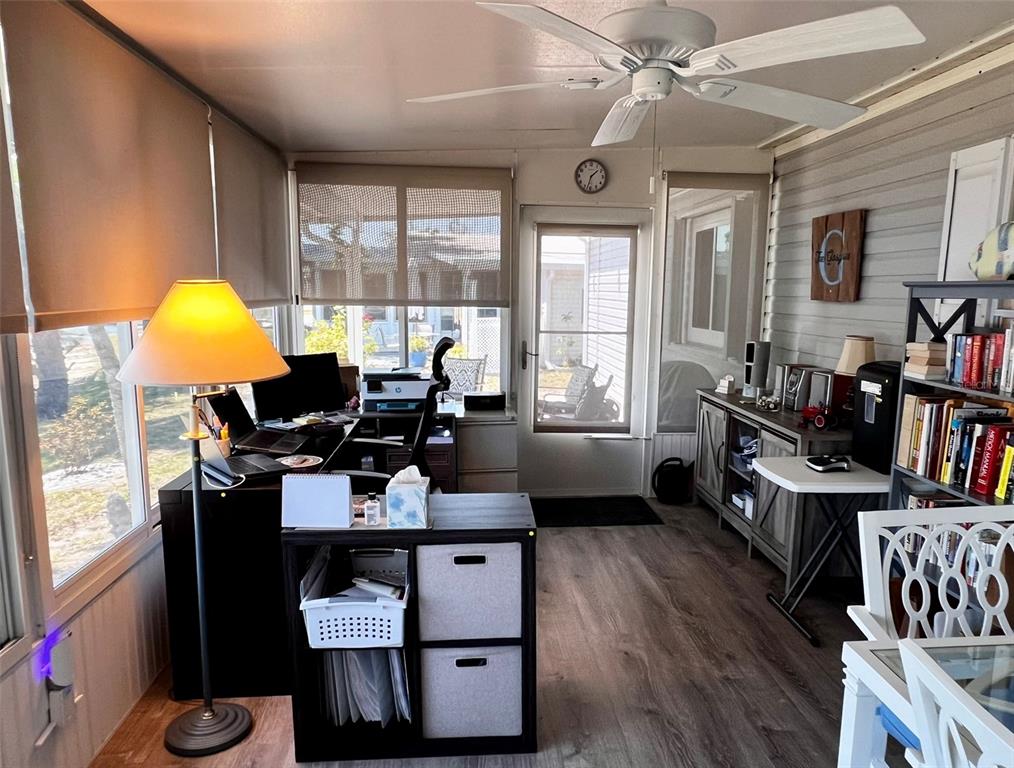 5601 Duncan Road, Unit 96 Punta Gorda, FL 33982 - Photo 23 of 30 a living room with furniture a window and bookshelf