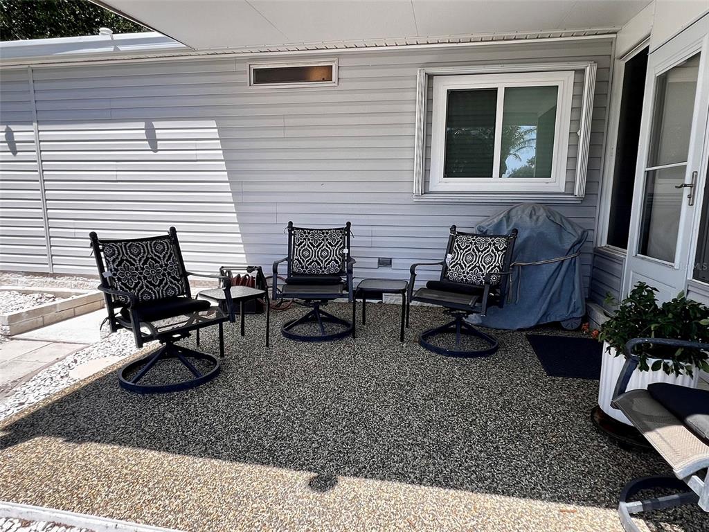 5601 Duncan Road, Unit 96 Punta Gorda, FL 33982 - Photo 24 of 30 a building outdoor space with patio furniture