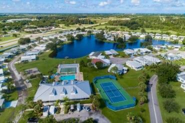 5601 Duncan Road, Unit 96 Punta Gorda, FL 33982 - Photo 28 of 30 an aerial view of residential houses with outdoor space and swimming pool