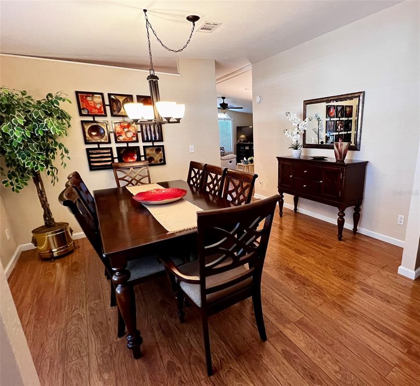 5601 Duncan Road, Unit 96 Punta Gorda, FL 33982 - Photo 3 of 30 a outdoor dining space with furniture and rug